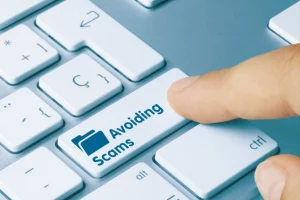 a button on a keyboard reading avoiding scams